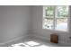 Bright bedroom featuring natural light from the large window and white trim at 1021 Smoke Willow Way # 130, Rolesville, NC 27571