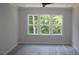 Bedroom with a large window offering ample natural light at 1021 Smoke Willow Way # 130, Rolesville, NC 27571