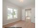 Bedroom with ample natural light, wood floors, and a view of the front yard at 1021 Smoke Willow Way # 130, Rolesville, NC 27571