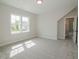 Well-lit bedroom with neutral walls and carpet flooring, and natural light from a window at 1021 Smoke Willow Way # 130, Rolesville, NC 27571