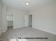 Spacious bedroom with neutral walls and carpet, featuring a closet and ample natural light from a bright window at 1021 Smoke Willow Way # 130, Rolesville, NC 27571
