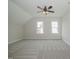 Open bedroom featuring plush carpet, a ceiling fan, and two windows at 1021 Smoke Willow Way # 130, Rolesville, NC 27571