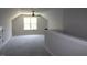 Spacious bonus room with a ceiling fan and plenty of natural light from the window at 1021 Smoke Willow Way # 130, Rolesville, NC 27571