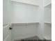 Well-organized closet with shelves and clothing rods, maximizing storage in a functional and tidy space at 1021 Smoke Willow Way # 130, Rolesville, NC 27571