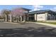 Beautifully landscaped clubhouse with stone pillars at Granite Falls Swim and Athletic Club at 1021 Smoke Willow Way # 130, Rolesville, NC 27571