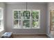 Bright dining area featuring large windows and natural light at 1021 Smoke Willow Way # 130, Rolesville, NC 27571
