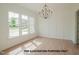 Bright dining room with hardwood floors, large windows, and a chandelier at 1021 Smoke Willow Way # 130, Rolesville, NC 27571