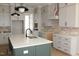 Kitchen with island, quartz countertops, stainless appliances and neutral backsplash at 1021 Smoke Willow Way # 130, Rolesville, NC 27571