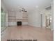 Cozy living room with fireplace, built-in shelving, and sliding glass doors that open to the outdoors at 1021 Smoke Willow Way # 130, Rolesville, NC 27571