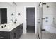 Main bathroom with double vanity, glass enclosed shower, and soaking tub at 1021 Smoke Willow Way # 130, Rolesville, NC 27571