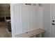Functional mudroom area with built-in bench, coat hooks, and storage space at 1021 Smoke Willow Way # 130, Rolesville, NC 27571