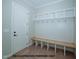 Convenient mudroom with custom built-ins, a bench, and coat hooks for organization at 1021 Smoke Willow Way # 130, Rolesville, NC 27571
