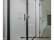 Contemporary shower with glass door, white tiled walls, and black trim for a modern and clean bathroom design at 1021 Smoke Willow Way # 130, Rolesville, NC 27571
