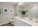 Main bathroom features a double vanity and updated shower at 104 Kobus Ct, Garner, NC 27529