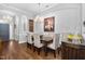 Elegant dining room with hardwood floors, a chandelier, and a large wooden table at 107 Sunstone Dr, Cary, NC 27519