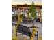 Covered patio with picnic tables and bench, ideal for gatherings at 119 Siebold St, Garner, NC 27529