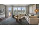 Gathering room with sectional sofa and access to balcony at 119 Siebold St, Garner, NC 27529