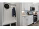 Kitchen features white cabinets and granite countertops at 119 Siebold St, Garner, NC 27529