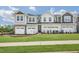 Two-story townhome with double garage and landscaped front yard at 120 Kobus Ct, Garner, NC 27529