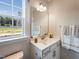 Clean bathroom with vanity, large mirror, and window at 1212 Coral Cay Bnd, Wake Forest, NC 27587