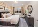 Spacious bedroom with a king-size bed, dresser, and large window at 1212 Coral Cay Bnd, Wake Forest, NC 27587