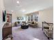 Bright bonus room with comfortable seating and large windows at 1212 Coral Cay Bnd, Wake Forest, NC 27587