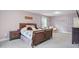 Main bedroom with floral bedding and plenty of natural light at 1610 Woodards Dairy Rd, Middlesex, NC 27557