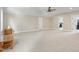 Spacious bonus room featuring light carpet, neutral paint, and great natural light at 1610 Woodards Dairy Rd, Middlesex, NC 27557