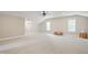 Large bonus room with vaulted ceilings, great light, and light carpet at 1610 Woodards Dairy Rd, Middlesex, NC 27557