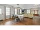 Bright dining area with hardwood floors and floral decor at 1610 Woodards Dairy Rd, Middlesex, NC 27557