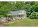 House exterior showcasing wrap around porch at 1610 Woodards Dairy Rd, Middlesex, NC 27557