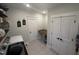 Charming laundry room with overhead decor and convenient built-in folding table at 1610 Woodards Dairy Rd, Middlesex, NC 27557