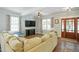 Spacious living room with large sectional sofa and hardwood floors at 1610 Woodards Dairy Rd, Middlesex, NC 27557