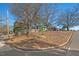 House with a large lot and surrounding trees at 1801 Liberty St, Durham, NC 27703