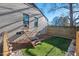 Small fenced grassy backyard with pet ramp at 1801 Liberty St, Durham, NC 27703