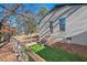 Small fenced grassy backyard with pet ramp at 1801 Liberty St, Durham, NC 27703