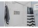 Bathroom with shower/tub combo and window at 1801 Liberty St, Durham, NC 27703