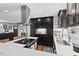 Modern kitchen with dark cabinetry, white quartz countertops, and stainless steel appliances at 1801 Liberty St, Durham, NC 27703