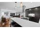 Modern kitchen with dark cabinetry, white quartz countertops, and stainless steel appliances at 1801 Liberty St, Durham, NC 27703