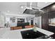 Modern kitchen with dark cabinetry, white quartz countertops, and stainless steel appliances at 1801 Liberty St, Durham, NC 27703