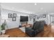 Bright living room with hardwood floors, recessed lighting, and modern decor at 1801 Liberty St, Durham, NC 27703