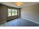 Bedroom featuring natural light from a window with exterior views and modern ceiling light at 190 Broadleaf Ln, Louisburg, NC 27549
