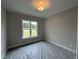 Cozy bedroom with natural light and a view of outdoors at 190 Broadleaf Ln, Louisburg, NC 27549