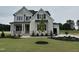 Charming two-story home with manicured lawn and landscaping at 190 Broadleaf Ln, Louisburg, NC 27549