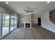 Living room with fireplace, built-ins, and access to screened deck at 190 Broadleaf Ln, Louisburg, NC 27549