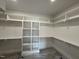 Walk-in closet with built-in shelving and ample storage space at 190 Broadleaf Ln, Louisburg, NC 27549