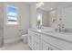 Bathroom featuring a double sink vanity with marble countertop, tile flooring, and walk-in shower at 190 Broadleaf Ln, Youngsville, NC 27596