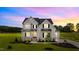 Gorgeous two-story home with a manicured lawn and craftsman-style architecture at 190 Broadleaf Ln, Youngsville, NC 27596