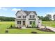 Beautifully landscaped two-story home with stone accents and a well-maintained lawn at 190 Broadleaf Ln, Youngsville, NC 27596