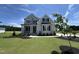 Beautiful two-story home with a manicured lawn, covered porch, and classic curb appeal at 190 Broadleaf Ln, Youngsville, NC 27596
